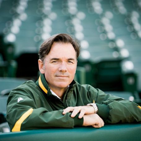 Young Billy Beane posing for a camera.